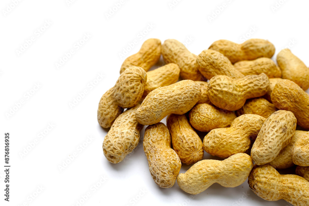 Roasted peanuts in shell on white background. Roasted peanuts in shell on white background.