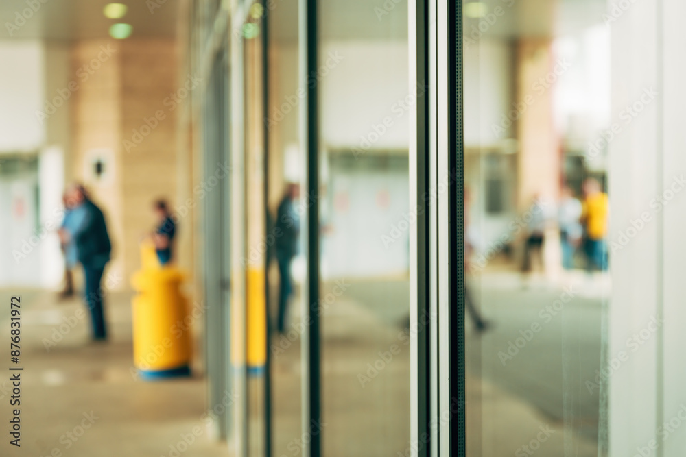 Blurred people in front of modern office building Blurred people in front of modern office building