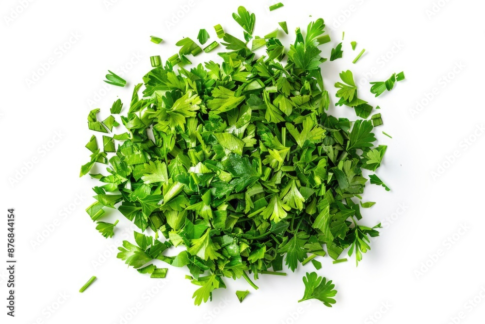 Obraz premium Freshly chopped parsley arranged on a clean white surface, perfect for garnishing or adding to recipes