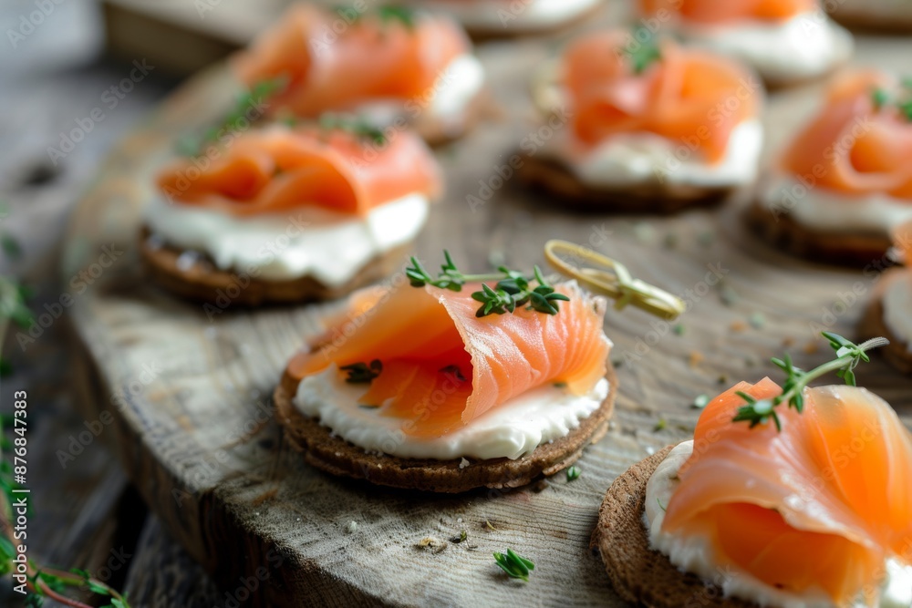 Enjoy delicious canapés featuring smoked salmon delicately paired with cream cheese. These elegant hors d'oeuvres are a sophisticated addition to any event or gathering.