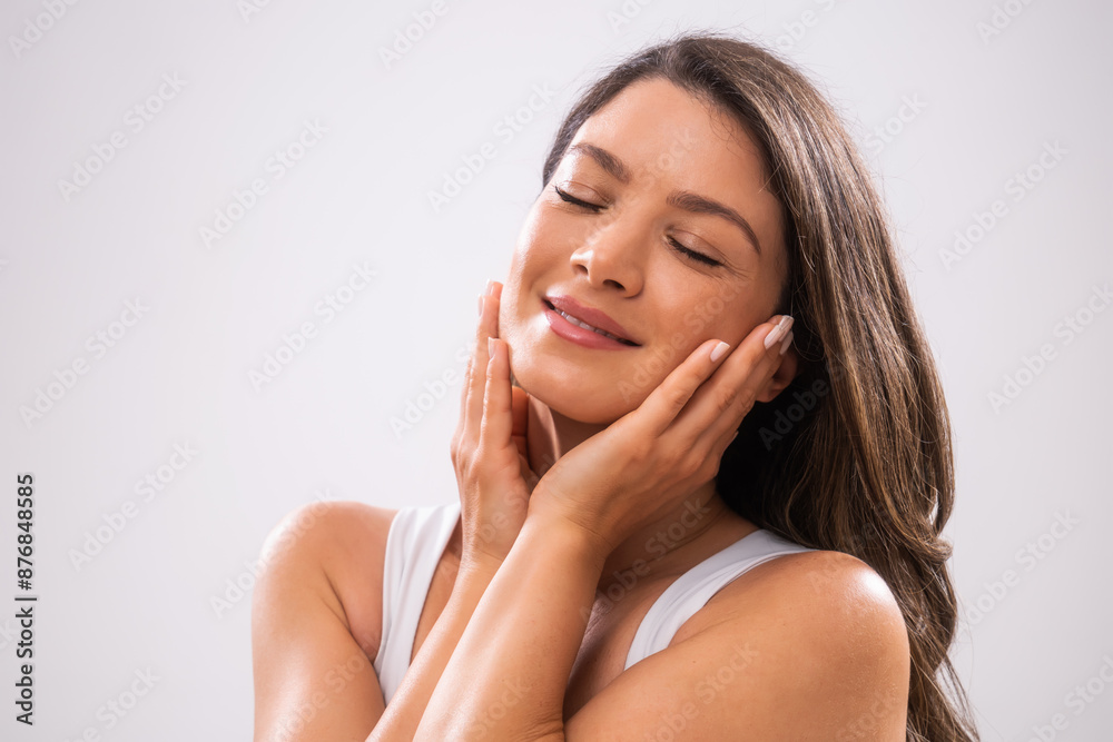Portrait of adult woman who is satisfied with her skin. Portrait of adult woman who is satisfied with her skin.