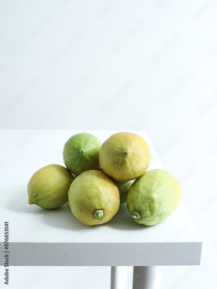 Summer fresh fruit lemon on white tabletop Summer fresh fruit lemon on white tabletop