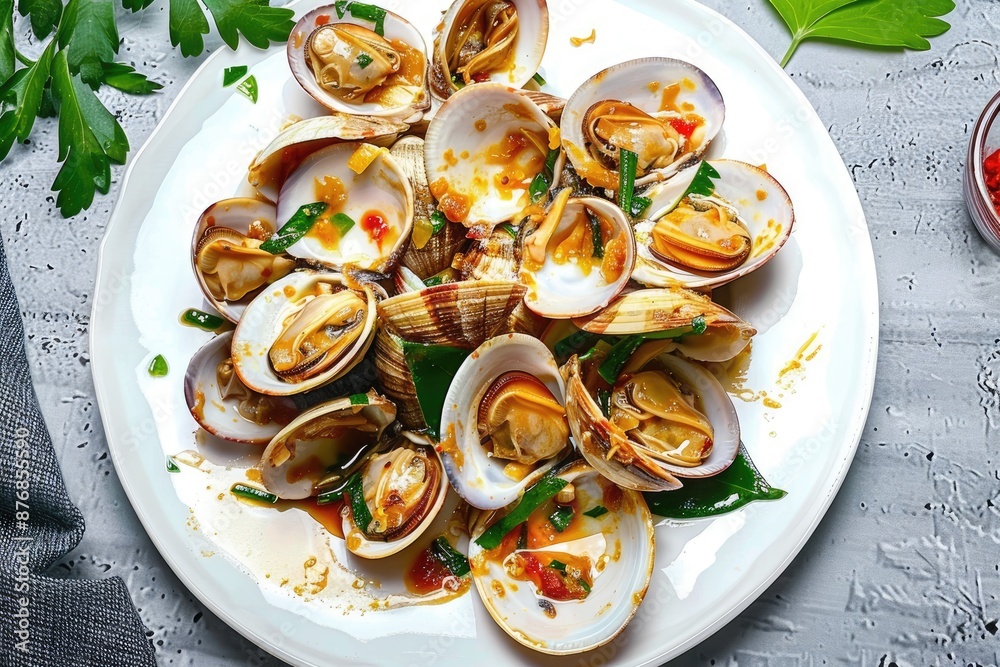 Fresh vongole Macro calms shell with sauce on grey background Fresh vongole Macro calms shell with sauce on grey background