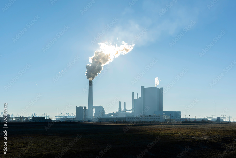 Chimney emitting smoke at coal fired power station under sky on field Chimney emitting smoke at coal fired power station under sky on field