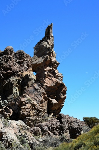 Scenic view of volcanic rock formations in desert during sunny day, Teide National Park, Tenerife photo