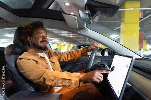 Man using touch screen navigation in car