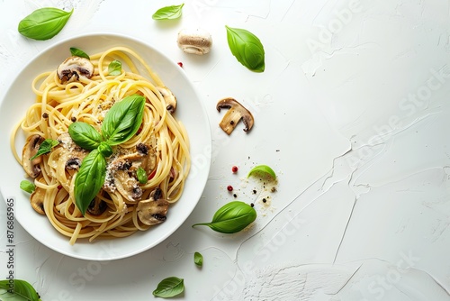 Pasta mushrooms with chicken, parmesa and basil on white backgroun, copy space, top view photo