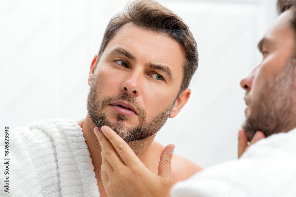 Male beauty. Cream treatment for male face. Beauty routine. Face of a beautiful man with perfect skin. Anti-aging and wrinkle cream. Concept of male beauty. Male skincare cosmetics concept. Skin care. Male beauty. Cream treatment for male face. Beauty routine. Face of a beautiful man with perfect skin. Anti-aging and wrinkle cream. Concept of male beauty. Male skincare cosmetics concept. Skin care.
