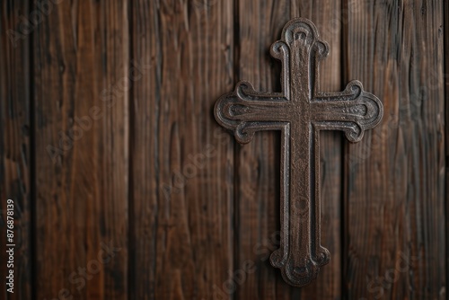 Ornate wooden cross on rustic background © Balaraw