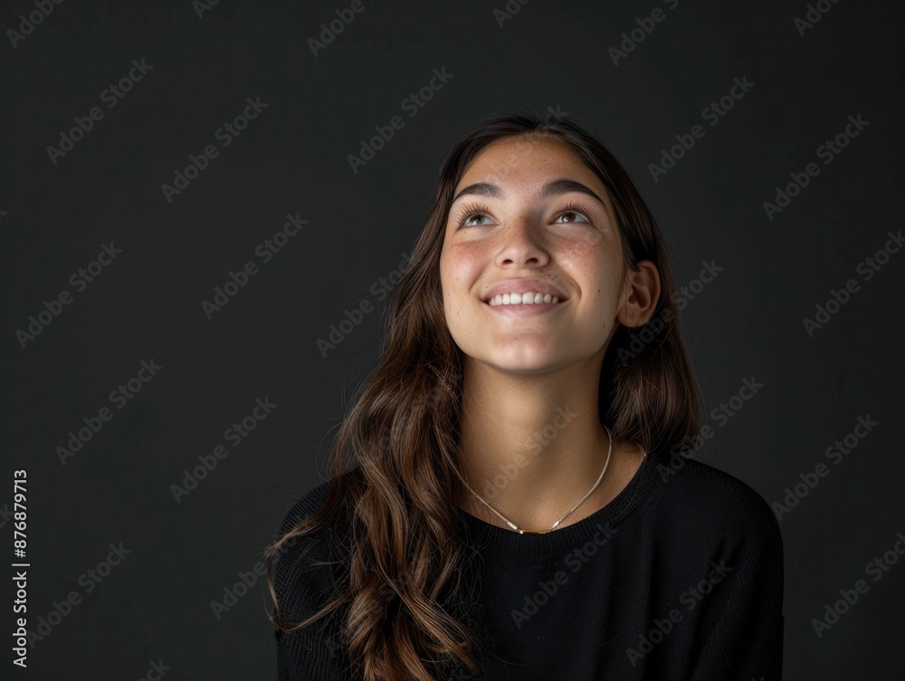 A woman with long brown hair wearing a black shirt, perfect for a wide range of uses including editorial, lifestyle, and more A woman with long brown hair wearing a black shirt, perfect for a wide range of uses including editorial, lifestyle, and more