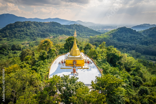 Aerial view of the gold pagoda on the top of the mountain at Wat Pa Sawang Bun, Saraburi, Thailand photo