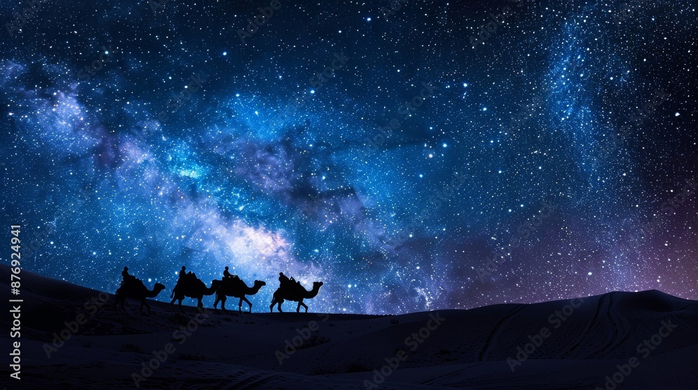 Tribal camel caravans traveling through vast desert landscapes It is silhouetted against the starry night sky decorated with the Milky Way. Tribal camel caravans traveling through vast desert landscapes It is silhouetted against the starry night sky decorated with the Milky Way.