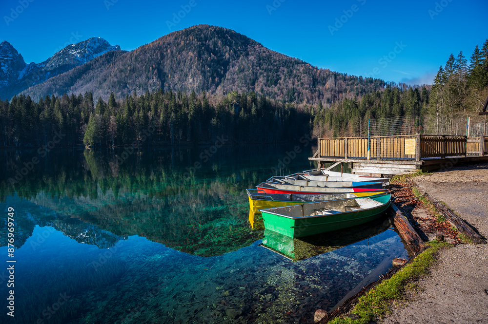 Morning in the Fusine lakes valley. Autumn reflections. Morning in the Fusine lakes valley. Autumn reflections.