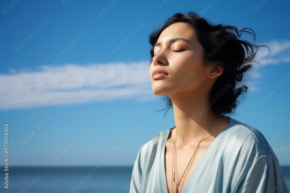 photo of woman praying with bluesky on the sea with blurred vision. photo of woman praying with bluesky on the sea with blurred vision.