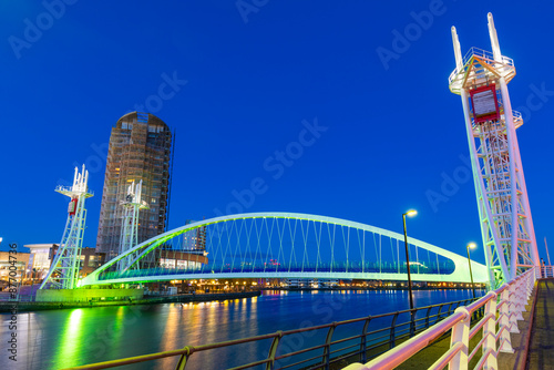 Millennium Bridge, footbridge at dusk, Salford Quays, Media City UK, Greater Manchester, England, United Kingdom, Europe photo