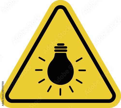 Sign bright light bulb. Sign bright light Warning sign about bright light or bright bulb. The light source may be harmful to the eyes. Incandescent lamp. Warning yellow triangular road sign.