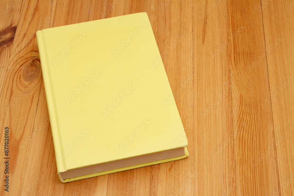 Retro old yellow book on a desk Retro old yellow book on a desk