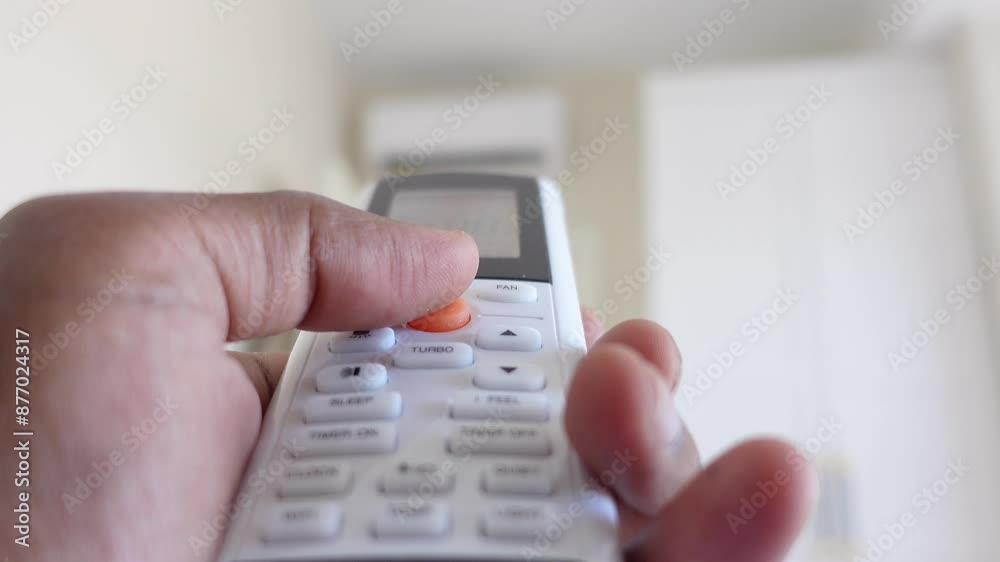 Close up of man hand holding air condition remote. Close up of man hand holding air condition remote.