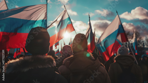 World Day of Russian Unity. Human hands are holding Russian flags. Celebration of the National Day. Independence Day. A patriotic concept. photo