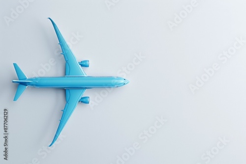 Wallpaper Mural Top view of a blue airplane isolated on white light background ideal for travel and aviation concepts Torontodigital.ca