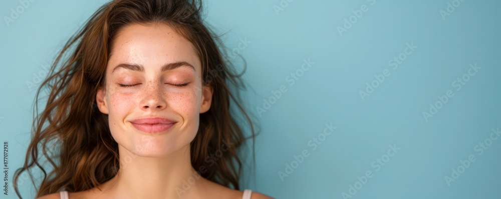 a close-up of a beautiful woman with a serene expression, her face calm and her eyes closed as she enjoys a peaceful moment, providing clear copy space for text a close-up of a beautiful woman with a serene expression, her face calm and her eyes closed as she enjoys a peaceful moment, providing clear copy space for text