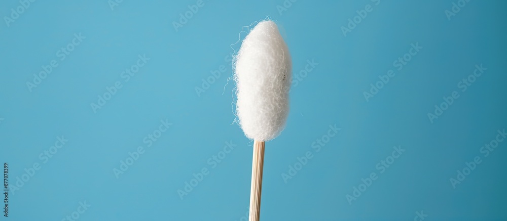 A cotton swab is shown in the copy space image. A cotton swab is shown in the copy space image.