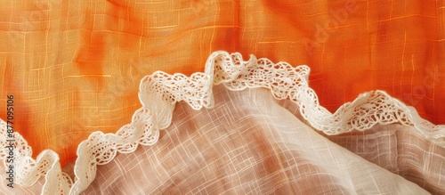 Natural linen with lace ribbon against a vibrant cloth backdrop, creating a border frame for a copy space image.