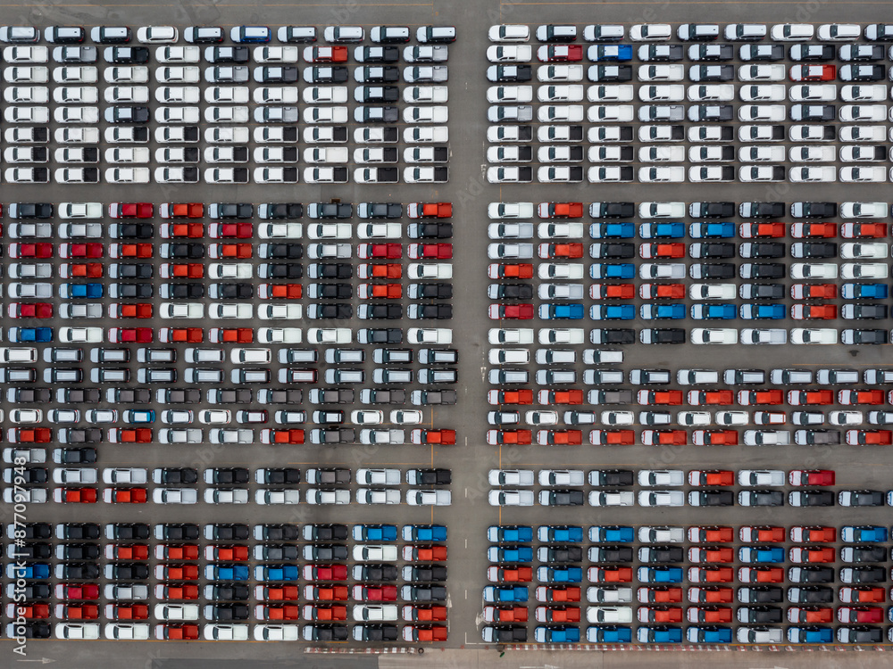 Aerial view of new car stock at distribution center automobile factory, Row of new car for sale in port, New car lined up import and export business logistic to dealership for sale.