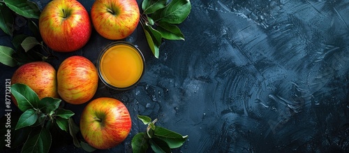 Chilled apple juice filled with pulp, unfiltered and unclarified, a refreshing vitamin-packed summer drink with apples, viewed from the top with copy space image. photo