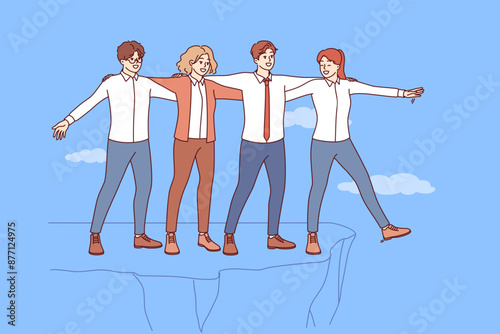 Well-coordinated teamwork business people allows to avoid risk and save colleagues from falling off cliff. Teamwork of men and women in business attire demonstrating successful synergy and unity
