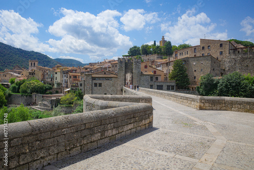 Girona, Spain - 7 July, 2024: The medieval Pont Vell bridge crossing the River Fluvia at Besalu, Catalonia photo