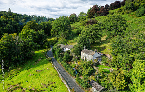 Obraz na płótnie Lake District National Park landscape with rural road and cottage near Loughrigg Tarn, Langdale, in the central Lakes between Ambleside and Grasmere w salonie