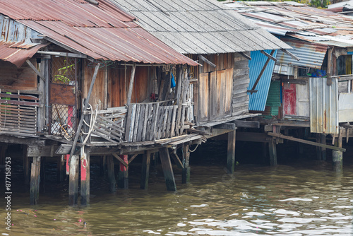 Wallpaper Mural Old collapsing wooden slums on stilts where thai people live on the Chao Phraya River in Bangkok, Thailand Torontodigital.ca