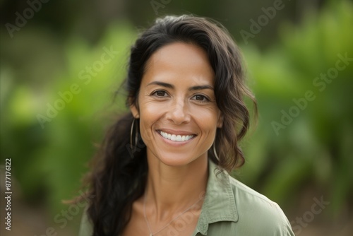 Close up portrait of a beautiful young woman smiling and looking at camera