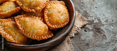 Brazilian Fried Pastel a savory meat filled pastry served at fairs often enjoyed as a dessert or appetizer depicted in a copy space image photo