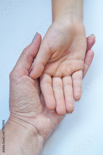 Palm of a child and an adult. Support and protection.     