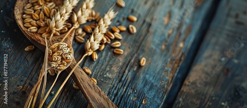A wooden spoon with wheat g...