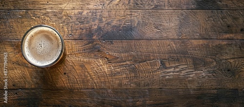 Top view of a beer cup on a wooden surface with space for writing or images. with copy space image. Place for adding text or design