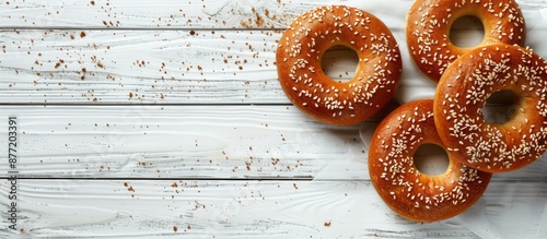 Mini bagels drying on white...