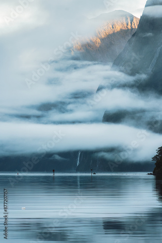 Milford Sound with waterfall in foggy on the lake at Fjordland national park, New Zealand photo