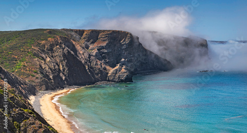 Scenic view Praia de Arrifana (Arrifana beach), beautiful beach and water borded by cliff  Algarve, Portugal