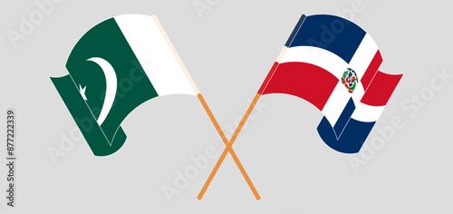 Crossed and waving flags of Pakistan and Dominican Republic