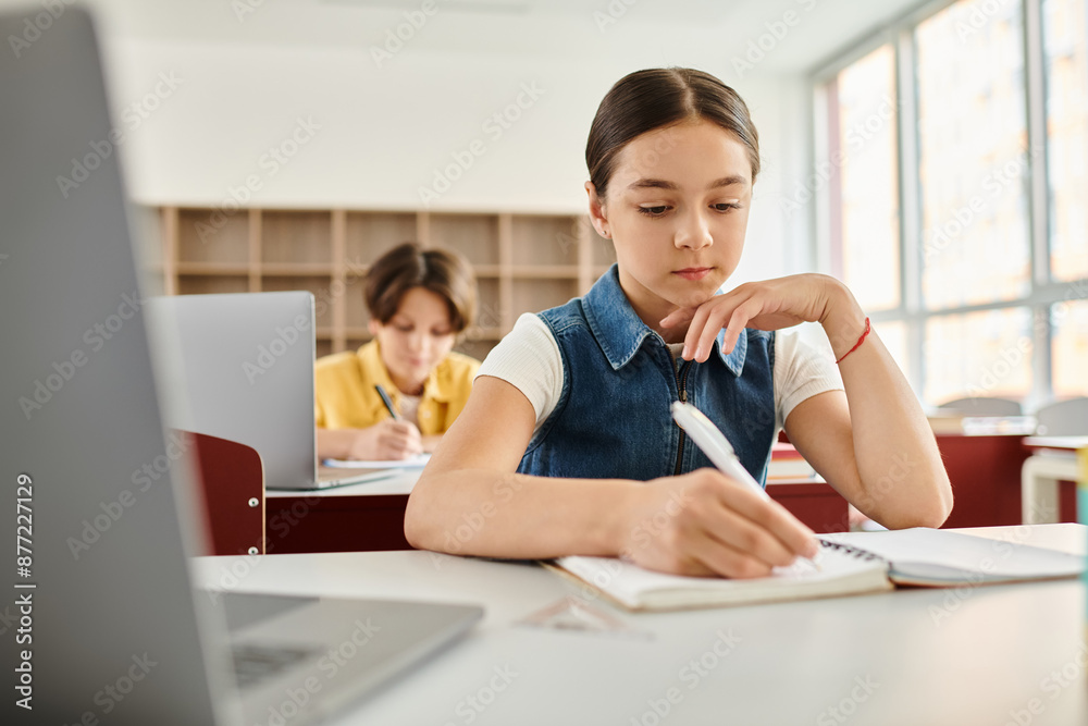 attentive students diligently takes notes as they learning in a vibrant classroom. attentive students diligently takes notes as they learning in a vibrant classroom.