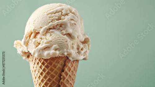 Soft ice cream in cone close up on light green background with copy space, hd, taken by Canon EOS. © horizon