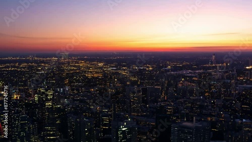 Wallpaper Mural An aerial view of a city at sunset, showing the cityscape bathed in the golden light of dusk. Torontodigital.ca