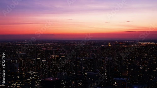 Wallpaper Mural A view from above of the New York City skyline, with a vibrant sunset illuminating the cityscape. Torontodigital.ca