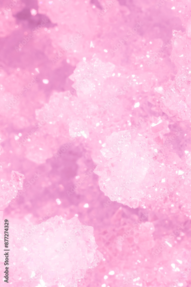 Fototapeta premium Amethyst pink crystals. Gems. Mineral crystals in the natural environment. Texture of precious and semiprecious stones. Seamless background with copy space colored shiny surface of precious stones.