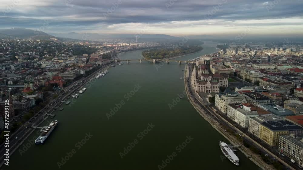 Aerial View Shot of Budapest, Hungary. Parliament Building. Capital Cityscape at daytime. Buda and Danube river. Elizabeth Square, Chain Bridge. Old city, Red roofs of beautiful historical buildings. Aerial View Shot of Budapest, Hungary. Parliament Building. Capital Cityscape at daytime. Buda and Danube river. Elizabeth Square, Chain Bridge. Old city, Red roofs of beautiful historical buildings.