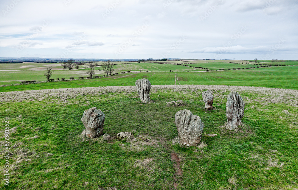 Duddo Five Stones prehistoric stone circle in north Northumberland, England. Early Bronze Age. Natural weathering soft sandstone. Looking north