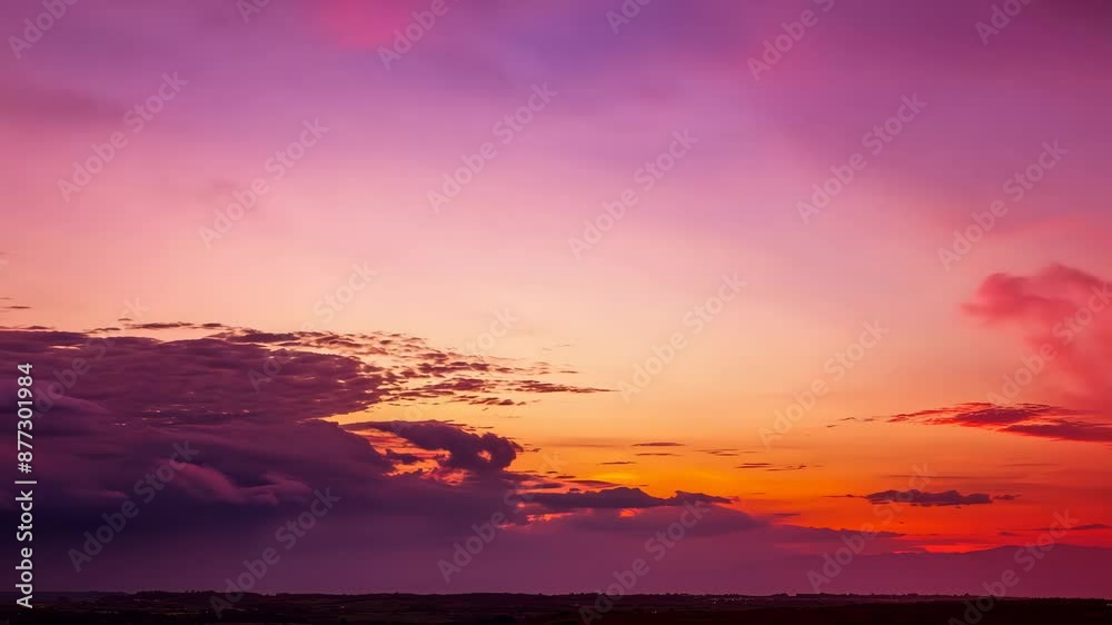 Experience the breathtaking transition of a sunset sky, with vibrant hues and dramatic cloud formations shifting from golden day to deep nocturnal blue Experience the breathtaking transition of a sunset sky, with vibrant hues and dramatic cloud formations shifting from golden day to deep nocturnal blue